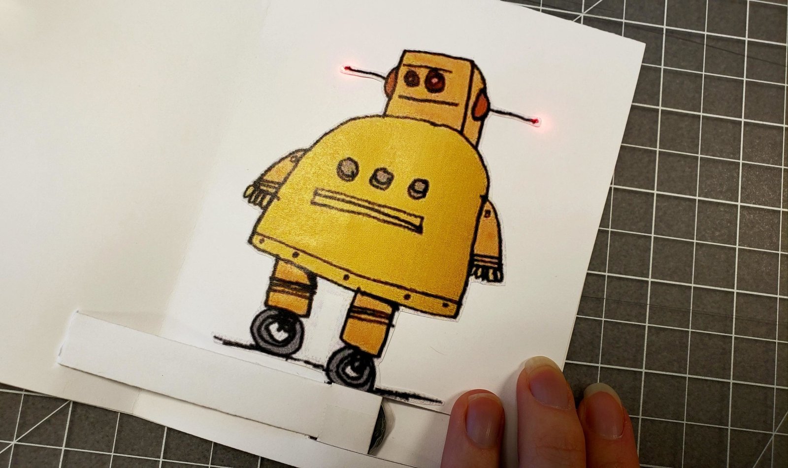 Sliding light-up greeting card