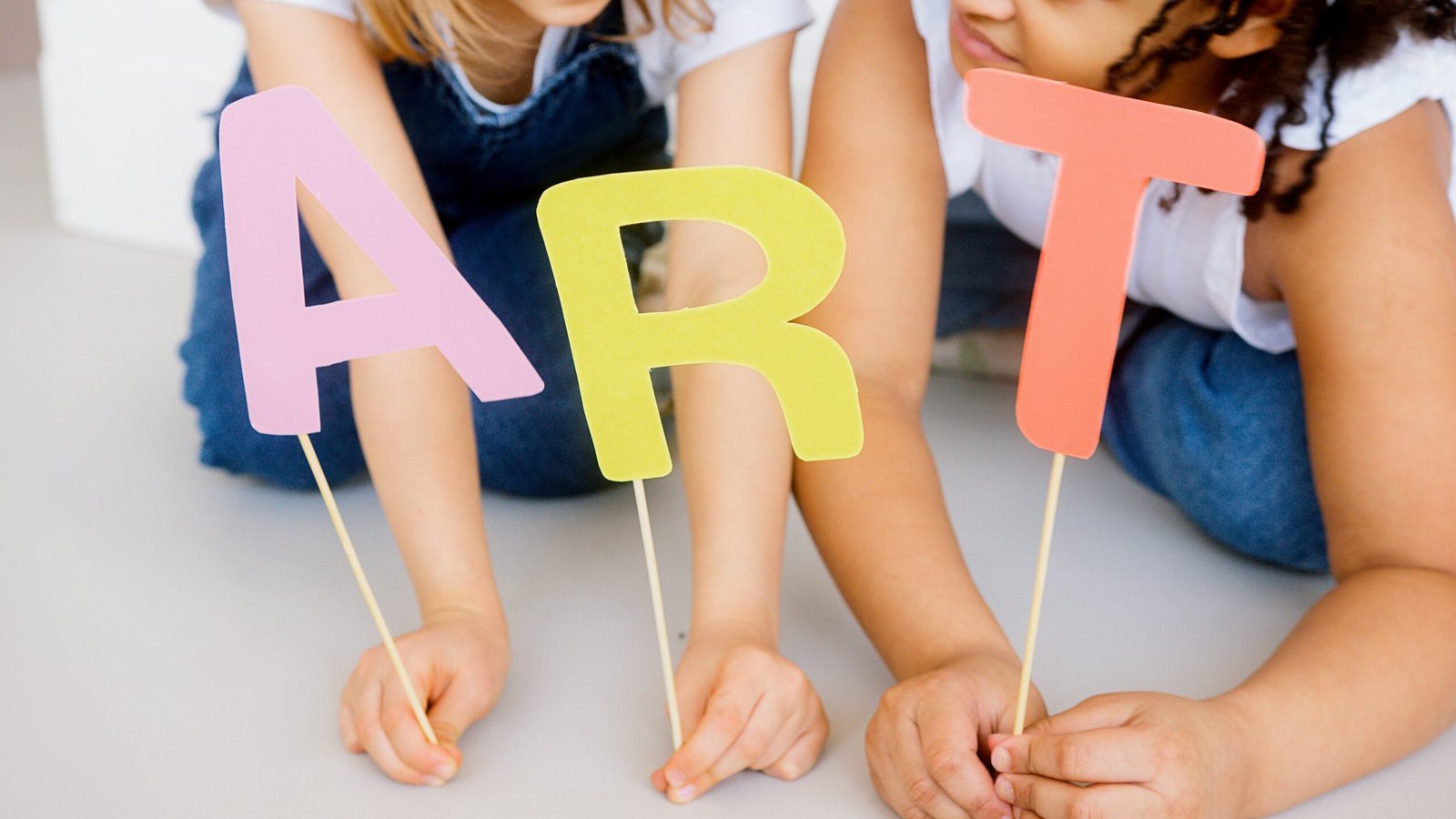 coloured paper letters on sticks