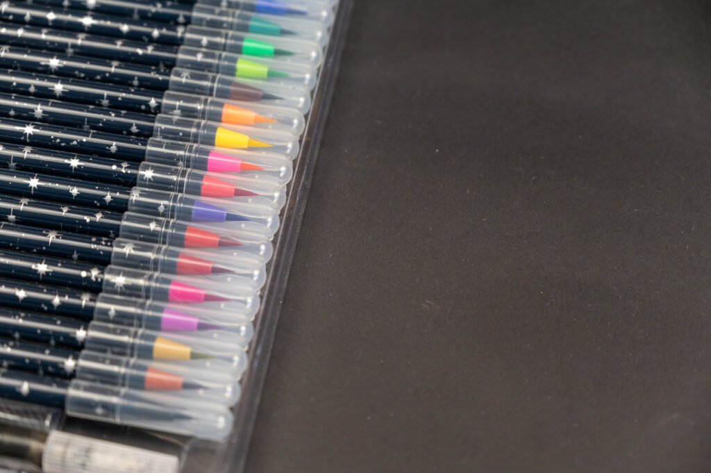 marker pens on black background